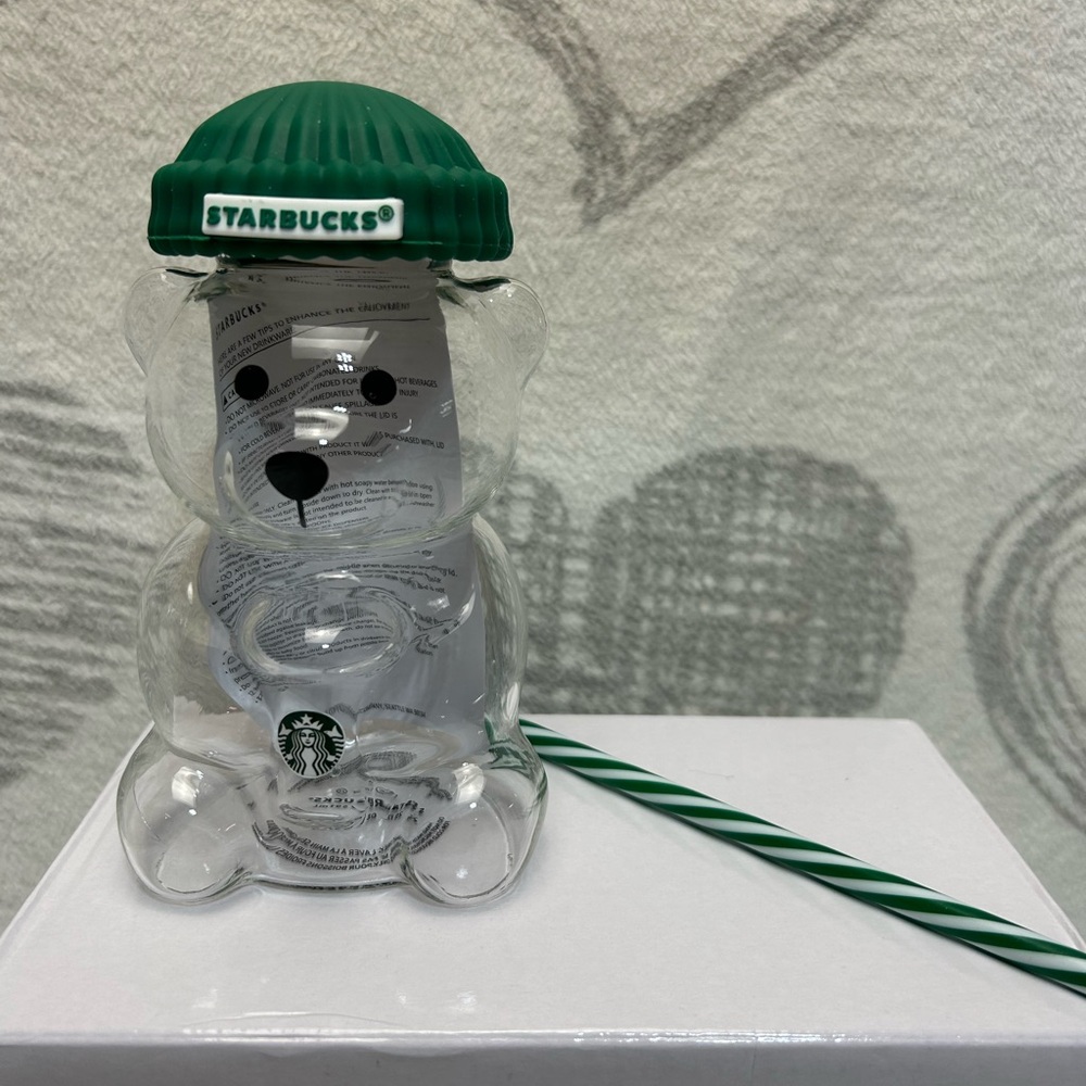 Similar bear glass cup with green straw